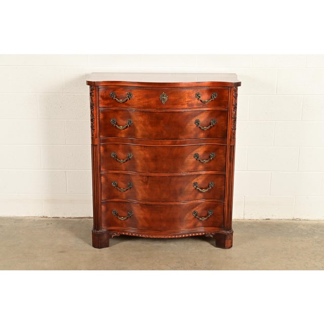 A gorgeous Chippendale or Georgian style serpentine front five-drawer highboy dresser or chest of drawers By Century...