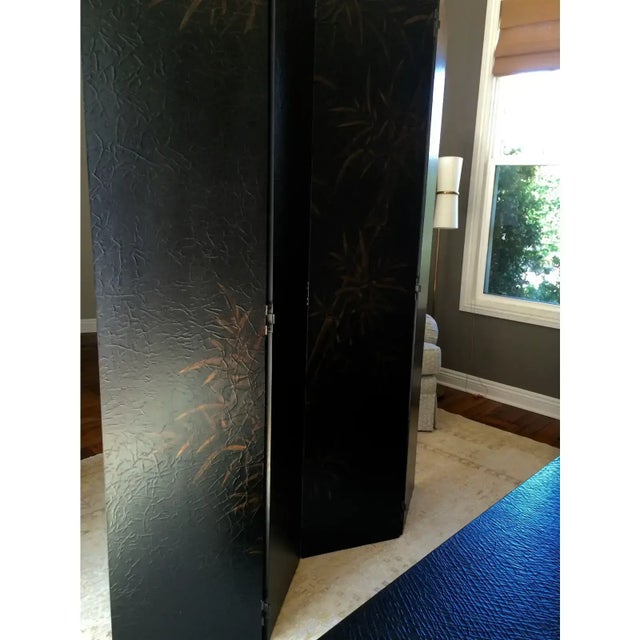 This is a Baker Furniture chinoiserie screen with a crackle finish and bamboo motif, it has four panels. Overall it is...
