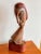 Large and striking vintage mid century expressionist wood carved bust of androgynous figure. Base and hair areas have been...