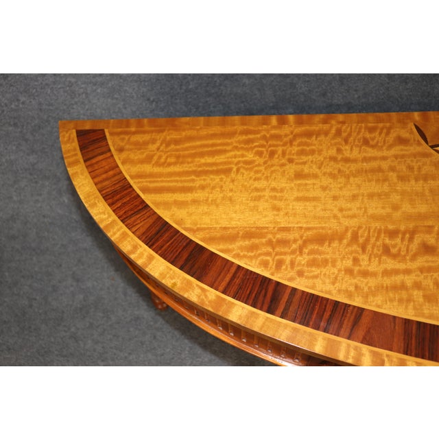 Dimensions: 34.5 inches high x 73 inches wide x 19.5 inches deep An elegant tribute to the refined neoclassicism of the...