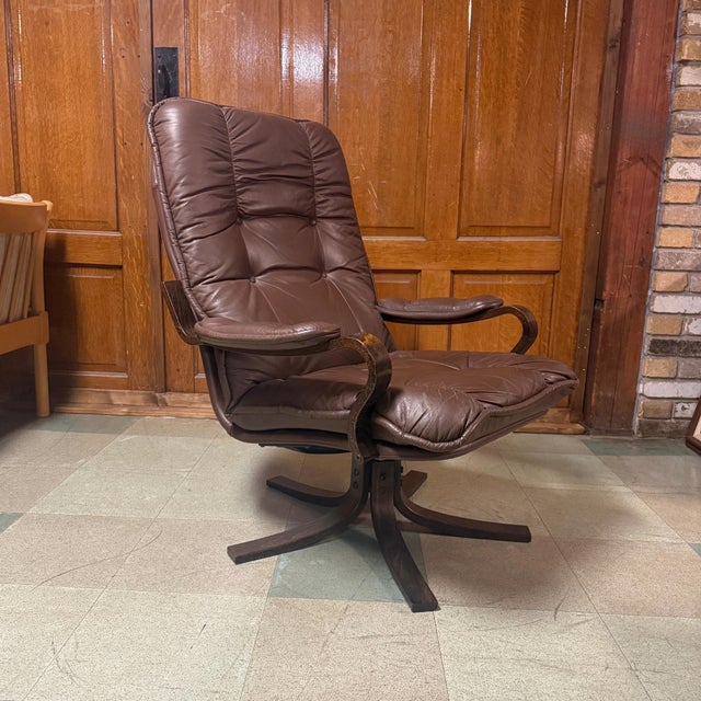 Vintage mid-century Danish modern leather and bentwood beech swivel armchair manufactured in Denmark. Excellent vintage...