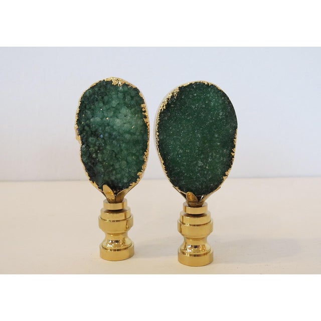 Banded in 14KT Gold and mounted on solid brass bases, these dynamic and sparkling geode finials will add a touch of luxury...