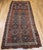 This charming antique Kazak area rug or runner from the Caucasus region, handwoven in the early 20th century, captivates...