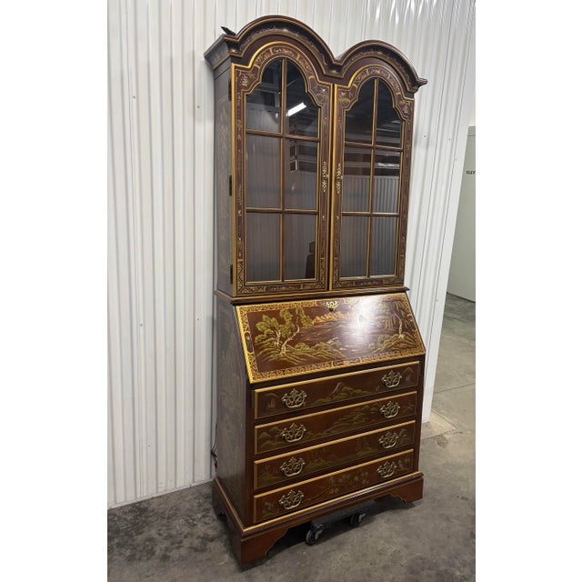 Beautiful one piece illuminated secretary with brown leather desk and artist hand painted chinoiserie details.