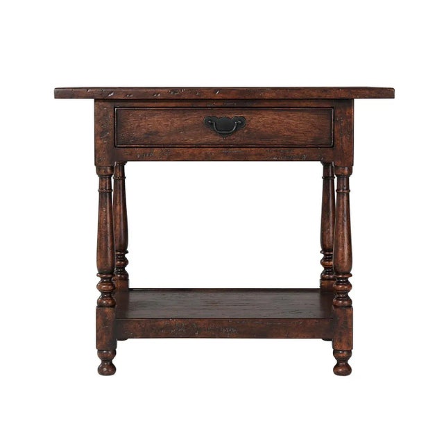 A William and Mary style reclaimed oak veneered and mahogany accent table, the planked top with a raised edge, above a...