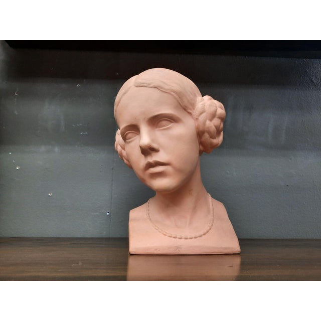 Beautiful clay bust of a woman. A very early work by Fritz Wolber. Fritz Wolber was a German sculptor and medalist. The...