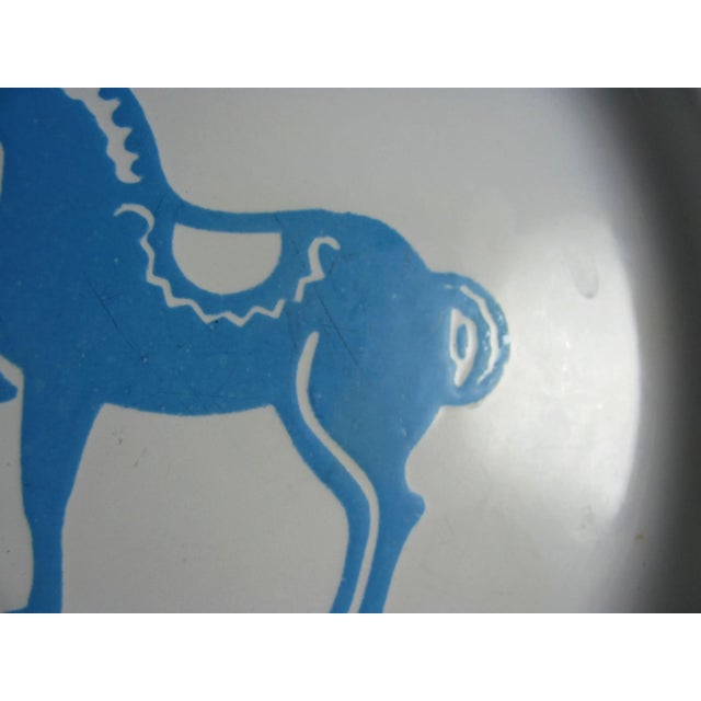 Colors are vibrant and crisp with little, if any, color loss Several dark utensil marks inside back half of horse (pics 1,...