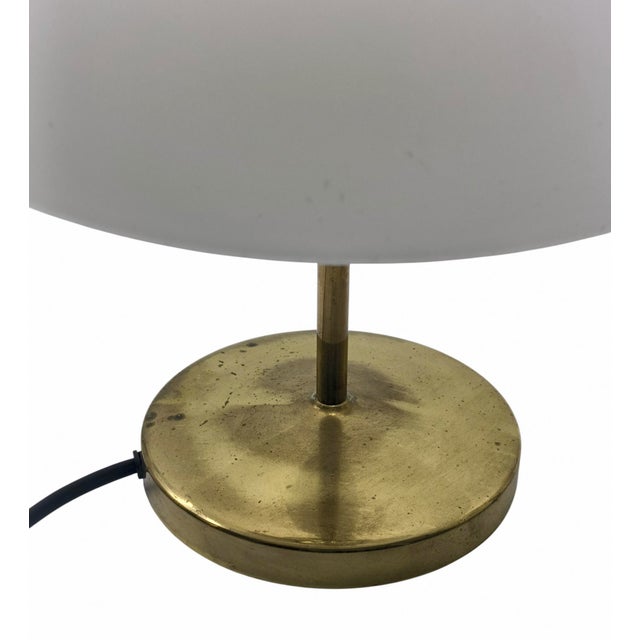 Pair of 'Arenzano Bassa' table lamps by Ignazio Gardella in brass and glass. In 1956, the master Ignazio Gardella created...