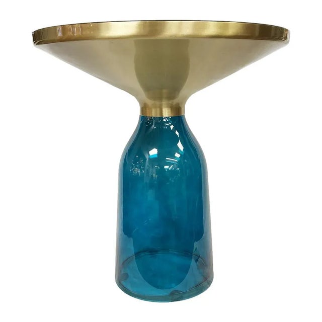 From Bellini Modern, the ritz side table is crafted from a heavy blown glass base topped with a sleek brushed lacquered...