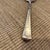 Sterling silver hammered finish antique serving spoon. No monogram.