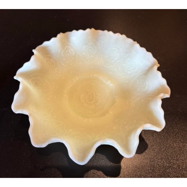 This is a beautiful Fenton “Persian Medallion” bowl in a custard color. It glows green under UV light. The bowl is about 8...