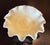 This is a beautiful Fenton “Persian Medallion” bowl in a custard color. It glows green under UV light. The bowl is about 8...