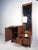 This Mid-Century cabinet features a beautiful walnut finish, cane front, tall mirror, pull-out surface with white finish,...