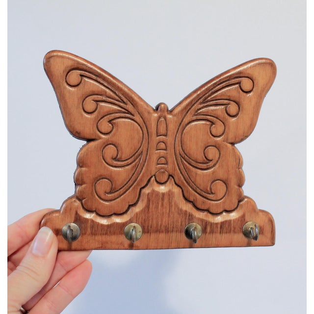 Vintage wood butterfly key holder with four small hooks. No makers mark. Minor age wear. Ready to hang.