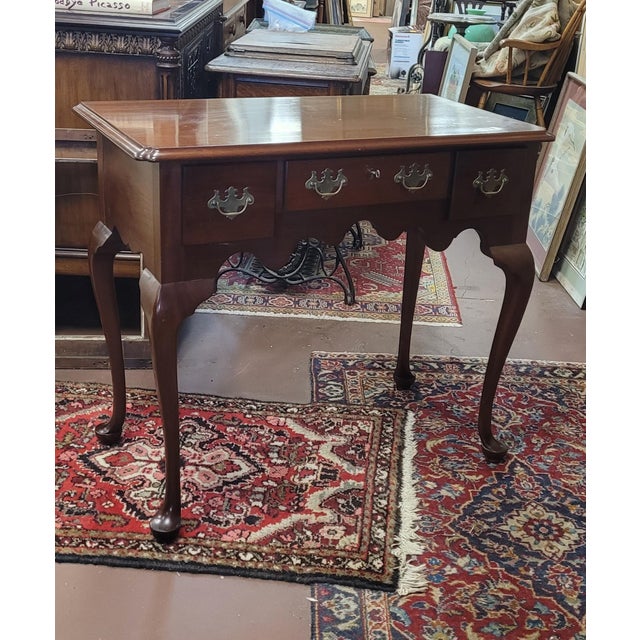 Beautiful custom-made Queen Anne style lowboy in solid cherry. Features authentic srtle Construction and brasses signed on...