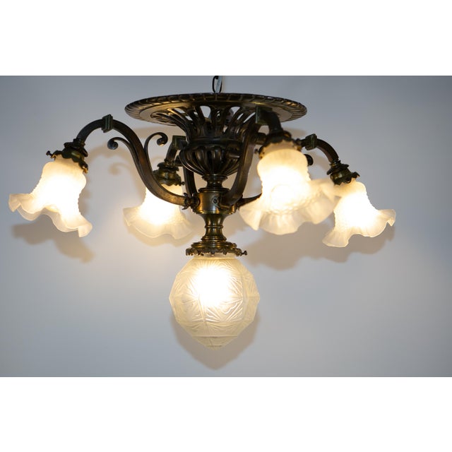 Extraordinary ceiling light from France, solid design, manufactured around 1920. Beautiful and heavy! The lamp is in very...