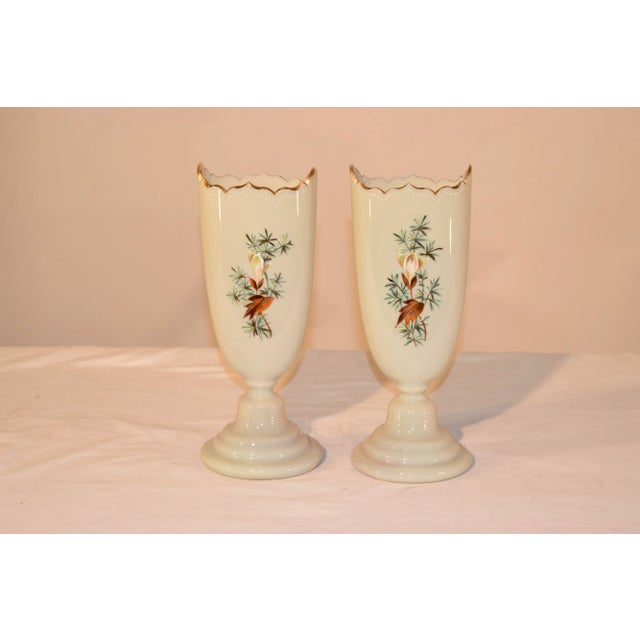 19th century pair of opaline glass vases from France in an unusual shape with a scalloped and gilt edge at the top and...
