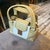 A Vintage Louis Vuitton Beige and White Leather Cruise Hand-Bag For Sale - Image 17 of 18