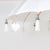 Exotic white cotton umbrella with bamboo ribs trimmed with carved wood and mother of pearl drops. The two-piece pole is...