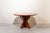 Mid-century Italian coffee table from the 1950s, crafted from walnut. It features a round table with a wide, smooth top...