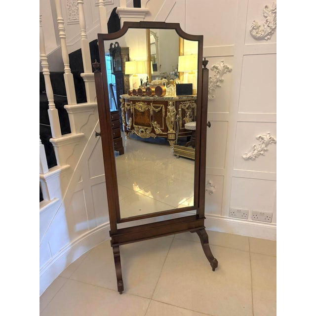 A refined Edwardian cheval mirror crafted in richly toned mahogany displaying elegant proportions and fine carved...