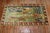 Lovely mid-20th century Russian Karabagh rug with 4 running deers on a scenic background and brown floral border....