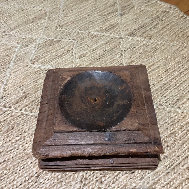 Perhaps crafted from a piece of architectural salvage, this interesting and heavy candle holder looks great with a big...