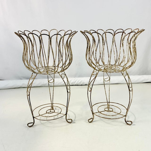 Vintage Home is pleased to present these 1950s French Jardiniere Planters. The bowls are a large Tulip shape in the Trompe...