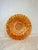 Gorgeous iridescent orange glass, with a kaleidoscopic “Coin Dot” pattern and a darling ruffled edge.