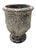 A vintage terracotta garden planter featuring a heavily textured volcanic glaze in layered charcoal, cream, and earthy...