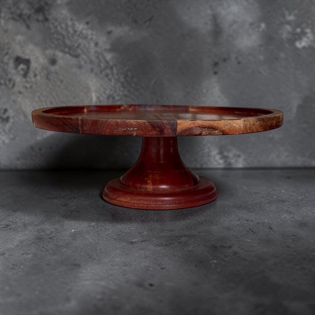 Vintage wooden pedestal cake or serving stand. So many uses from cake to fruit trays and more. Measures 12” diameter x...