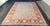Design Plus Gallery presents a Vintage Pakistani Hand-Knotted Wool and Silk Area Rug. The composition displays an ornate...