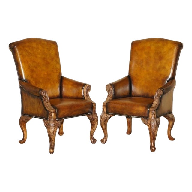 Pair of Antique Heavily Carved Hand Dyed Brown Leather Throne Armchairs For Sale