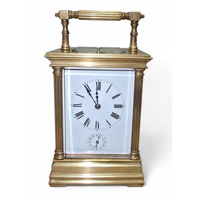 Elegant 19th century Spanish carriage clock crafted in finely cast gilt bronze. The case presents a refined architectural...