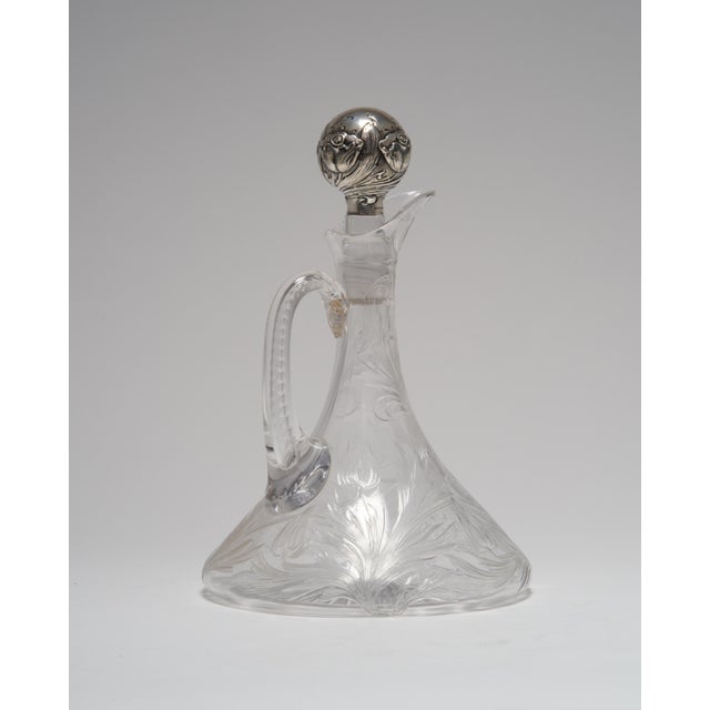 This gorgeous art nouveau ships decanter is cut with trailing poppy flowers and leaves. It has a slice cut loop handle and...