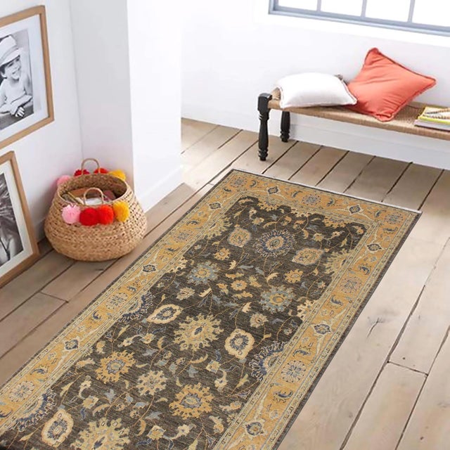 Enhance the ambiance of your home with this magnificent Persian-influenced Turkish hand-knotted rug made by skilled...