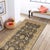 Enhance the ambiance of your home with this magnificent Persian-influenced Turkish hand-knotted rug made by skilled...