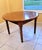 lassic antique round dining table with a warm mahogany finish and handsome turned legs. The piece has a simple farmhouse...
