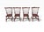 A handsome set of four D.R. Dimes Windsor-style dining chairs, stamped 1992. Crafted from oak and cherry, these chairs...