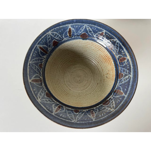 A charming vintage studio pottery bowl, hand-thrown and signed on the underside with an illegible artist’s mark dated...