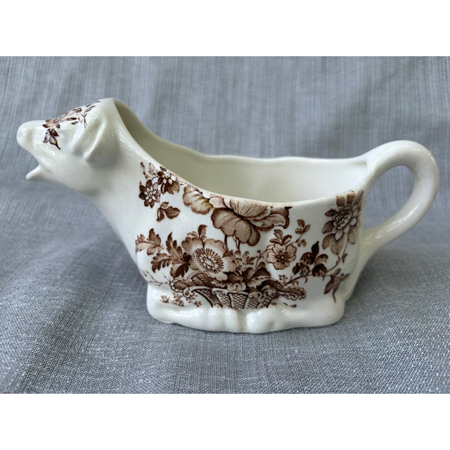 Sweet vintage white and brown floral transfer ware, ironstone cow pitcher, creamer. Made by Royal Crownford, in the United...
