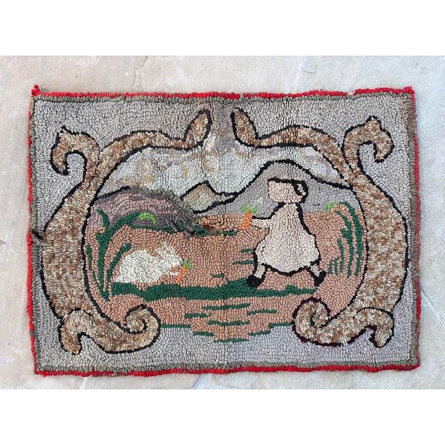Charming antique-style American folk art hooked rug featuring a whimsical pastoral scene of a white rabbit and duck...