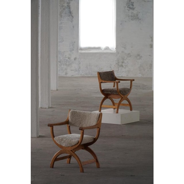 A fine and elegant armchair in solid oak, designed by henning kjærnulf for eg kvalitetsmøbel, denmark, 1960s. Model...