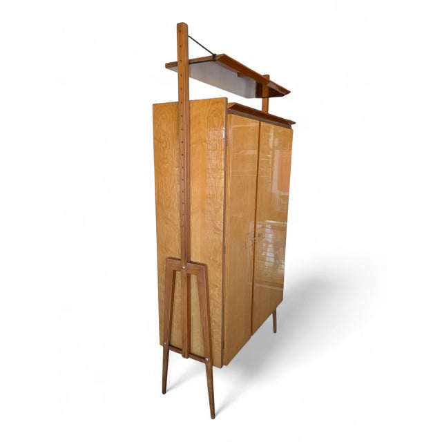 This 1960s bar cabinet perfectly embodies the Midcentury Modern aesthetic, distinguished by a refined contrast between the...