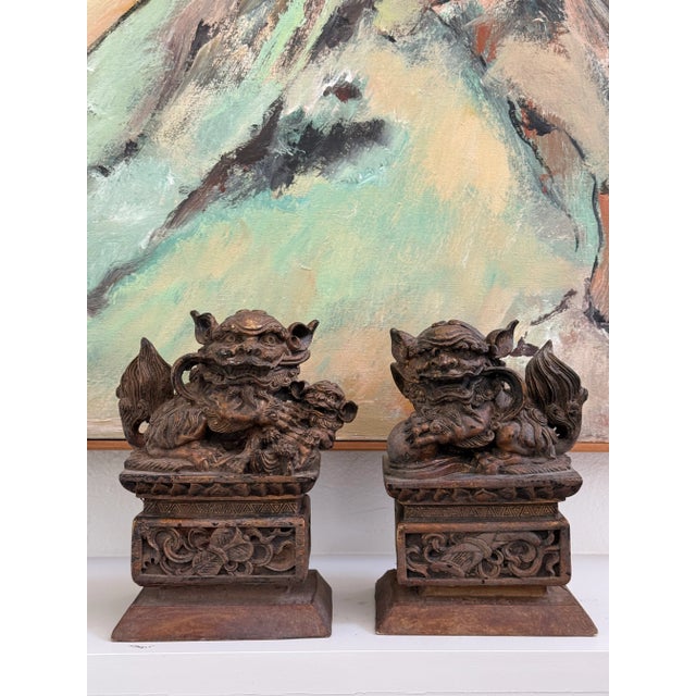 Pair 19th c. carved wood Chinese temple lions/foo dogs. Finely carved with remnants of gold paint still visible.