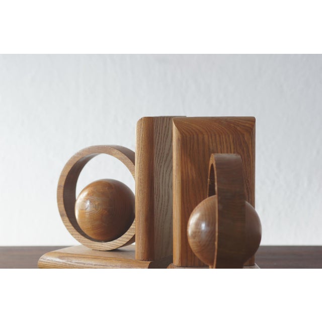 These wooden bookends have a distinctly sculptural, modernist character, combining practicality with decorative form. Each...