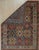 This hand knotted pile rug features a primary brown earth tone and is constructed from wool. Designed in the style of...