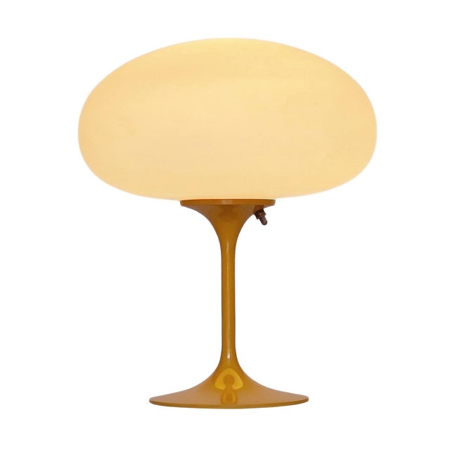 ENJOY FREE CONTINENTAL USA SHIPPING! A sleek stemlite table lamp made by Design Line. It features a cast aluminum main...