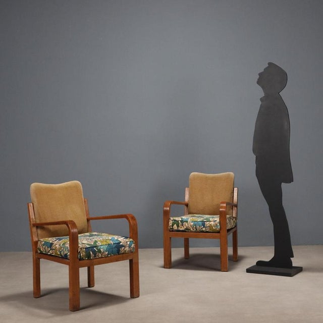 Pair of armchairs, oak frame, foam padding, and fabric upholstery. Fair condition, padding and upholstery in need of...