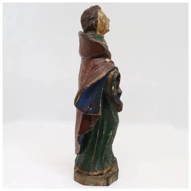 An antique hand carved and painted figure of a saint. STYLE Baroque PLACE OF ORIGIN Spain or France DATE 18th century...